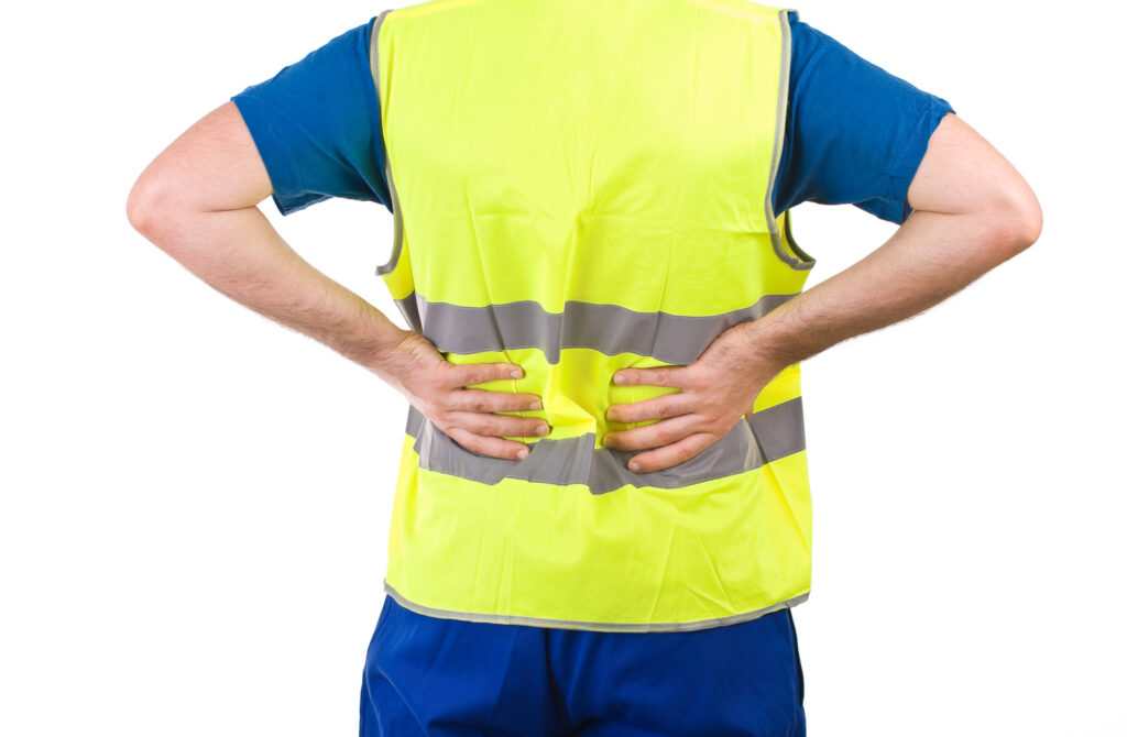 worker in a yellow vest with back pain