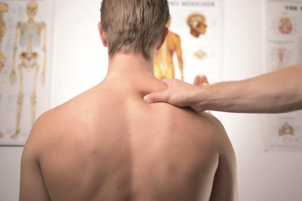 Man Getting A Neck Exam In A Healthcare Setting