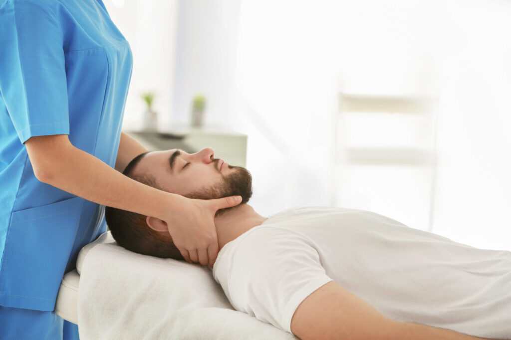 Physiotherapist working with patient in clinic